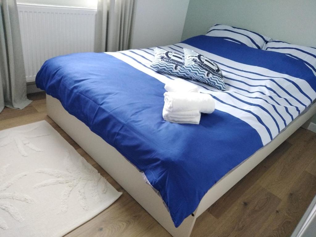מיטה או מיטות בחדר ב-Apartament prywatny Baltic Nova Władysławowo