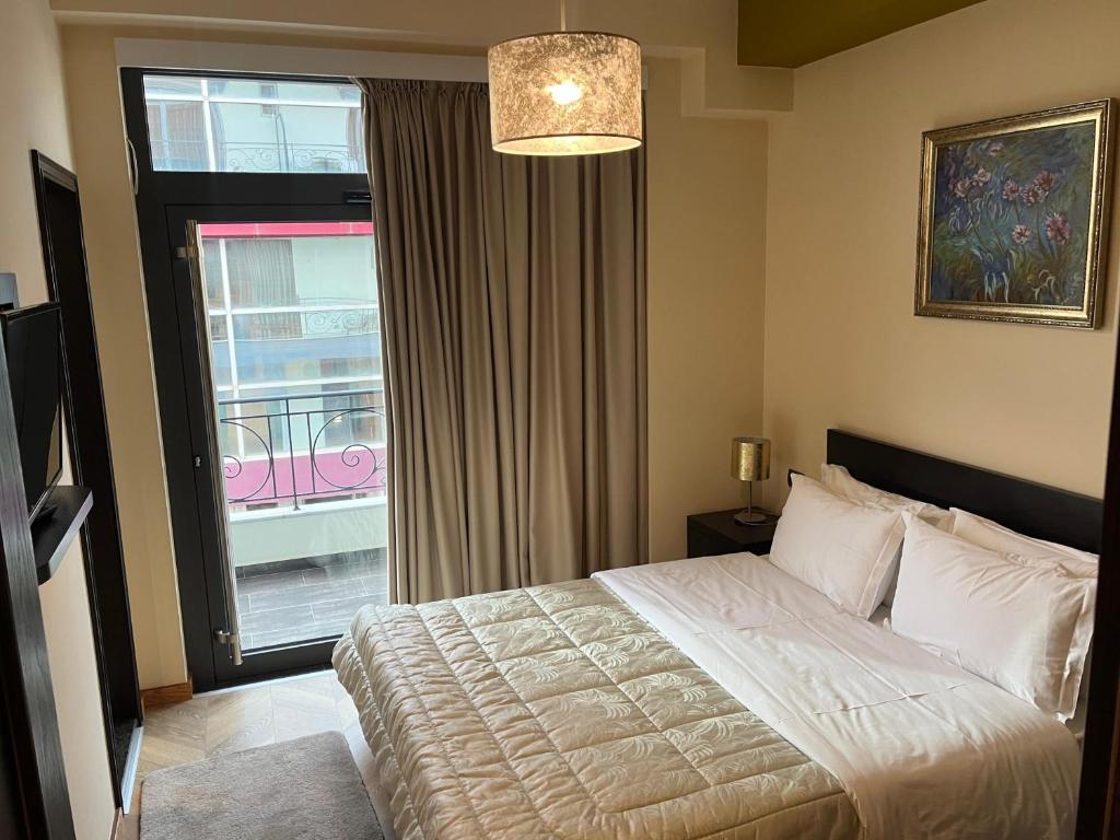 Postel nebo postele na pokoji v ubytování Dream's Hotel