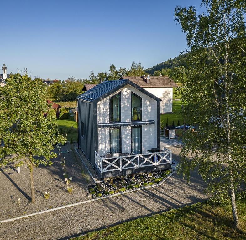 an overhead view of a black tiny house with trees at Ptaszkova PrzyStań in Ptaszkowa