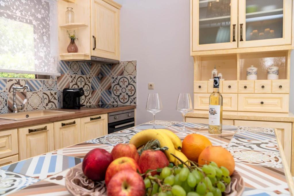 a bowl of fruit on a table in a kitchen at House 55 in Arta