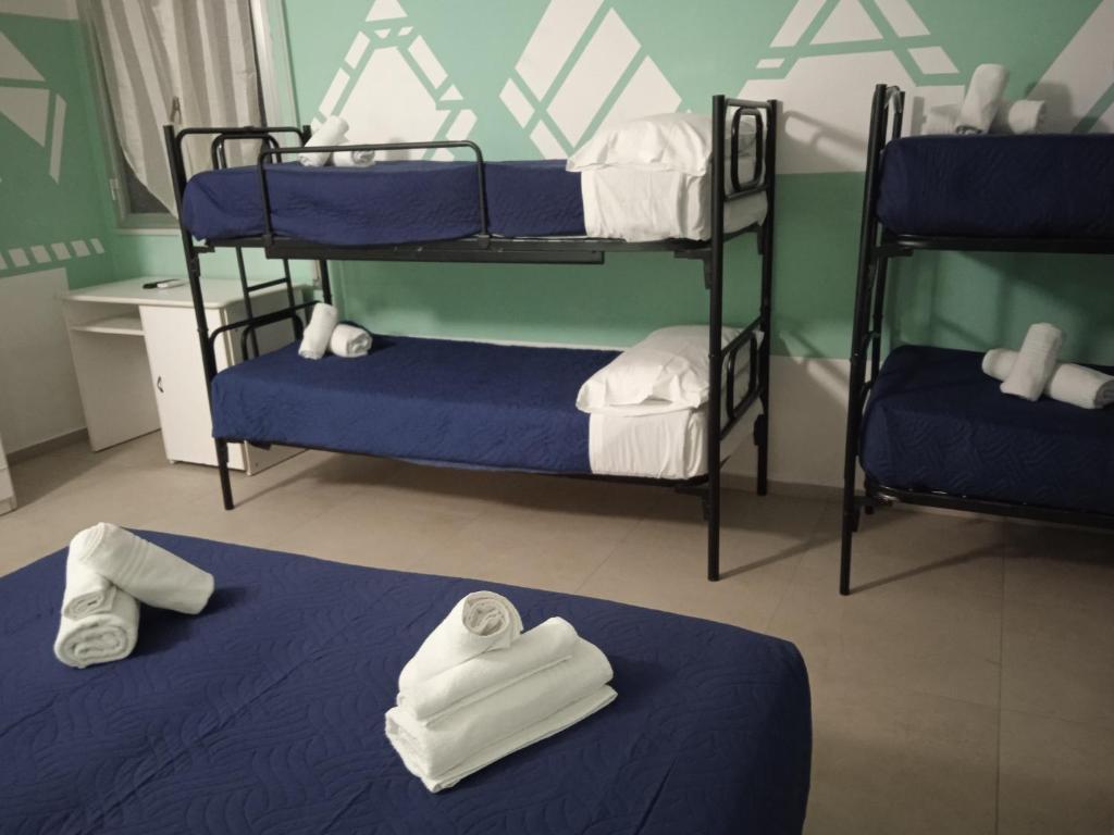 Postel nebo postele na pokoji v ubytování Hotel Napoleon