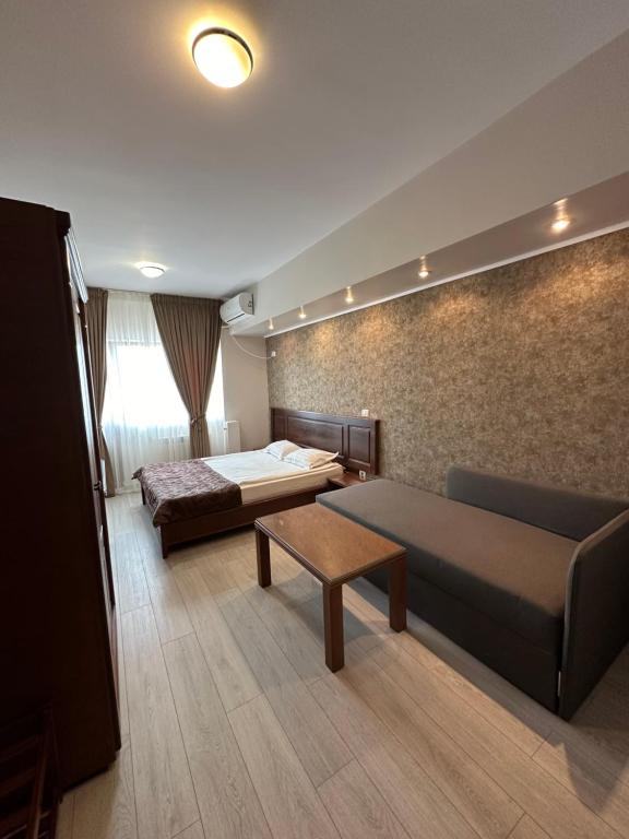 Postel nebo postele na pokoji v ubytování Hotel Ana