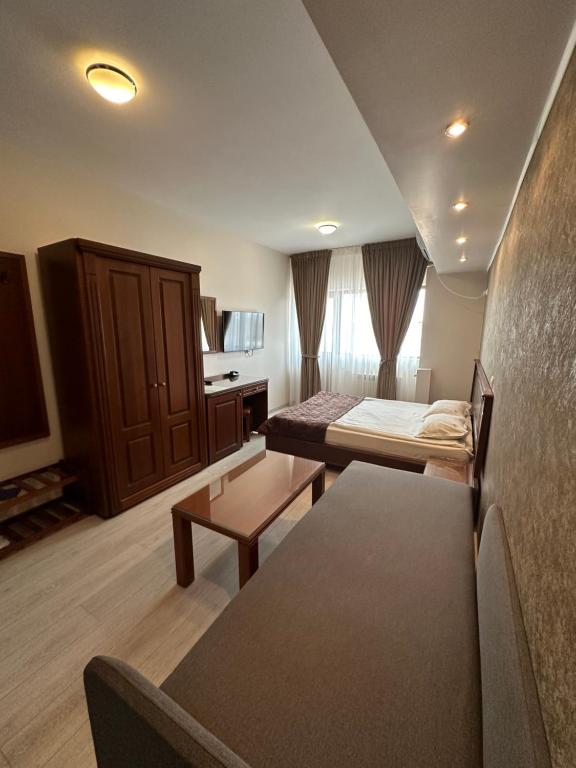 Postel nebo postele na pokoji v ubytování Hotel Ana