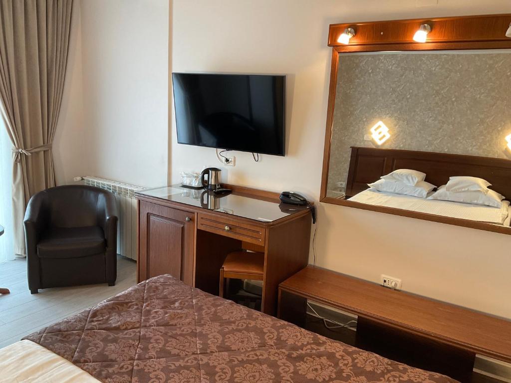 Postel nebo postele na pokoji v ubytování Hotel Ana
