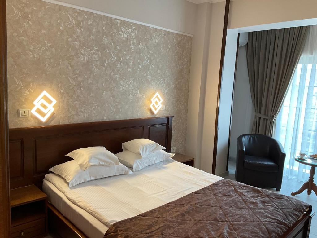 Postel nebo postele na pokoji v ubytování Hotel Ana