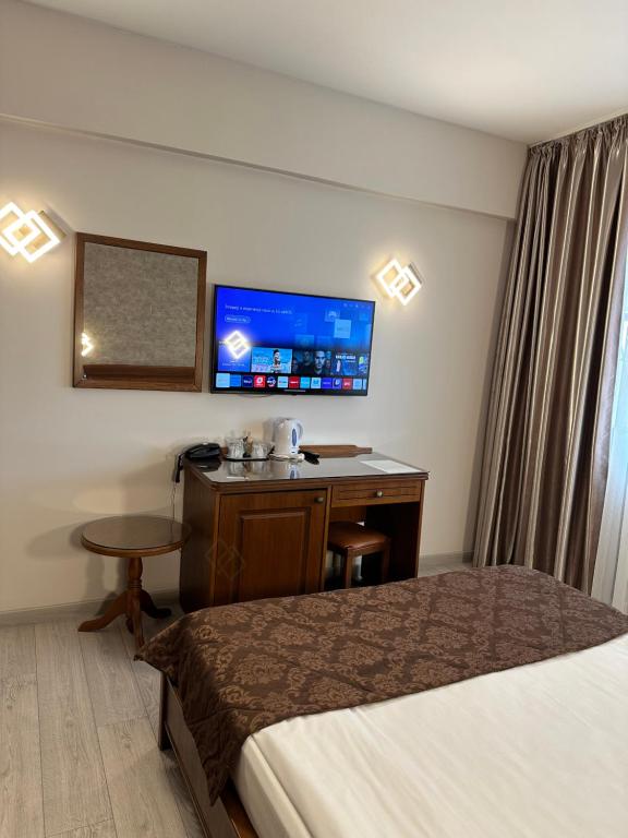 TV a/nebo společenská místnost v ubytování Hotel Ana