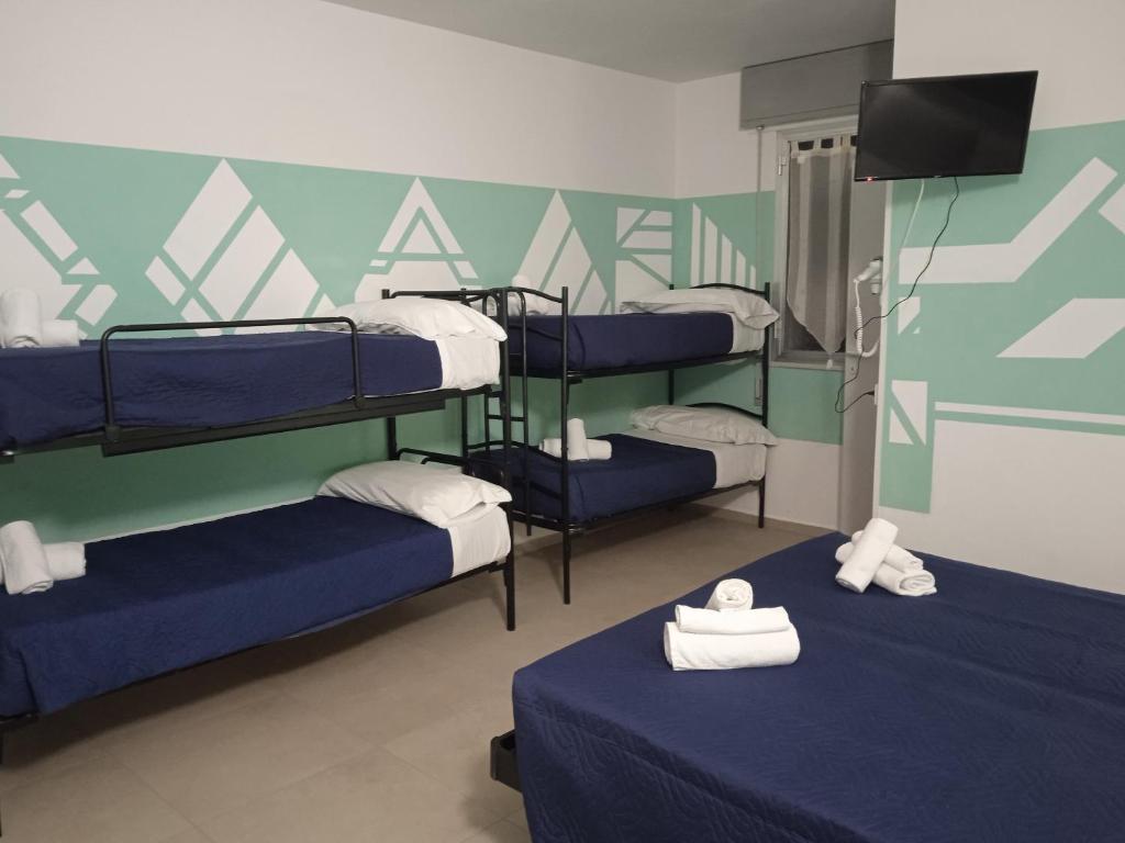 Postel nebo postele na pokoji v ubytování Hotel Napoleon