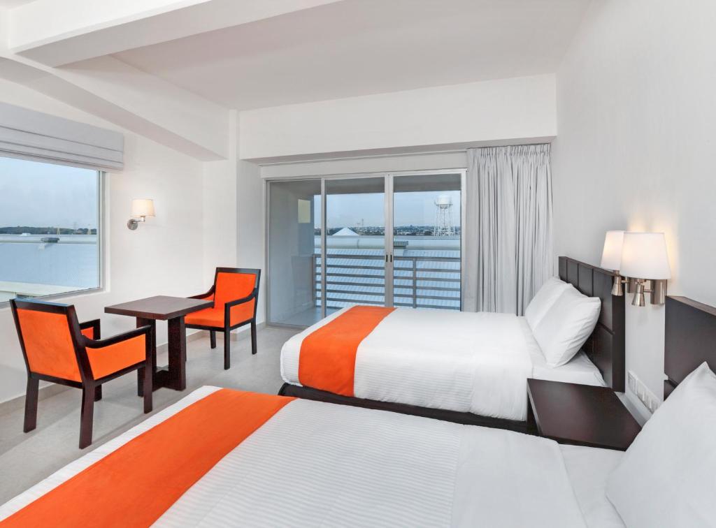 Postel nebo postele na pokoji v ubytování Hotel Yes Inn Nuevo Veracruz