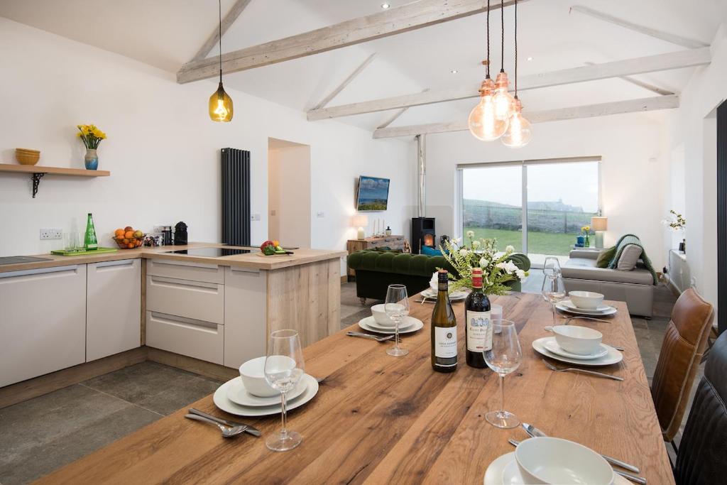 a kitchen and a table with wine bottles and glasses at 3 Bed in Belford oc-cn065 in Belford