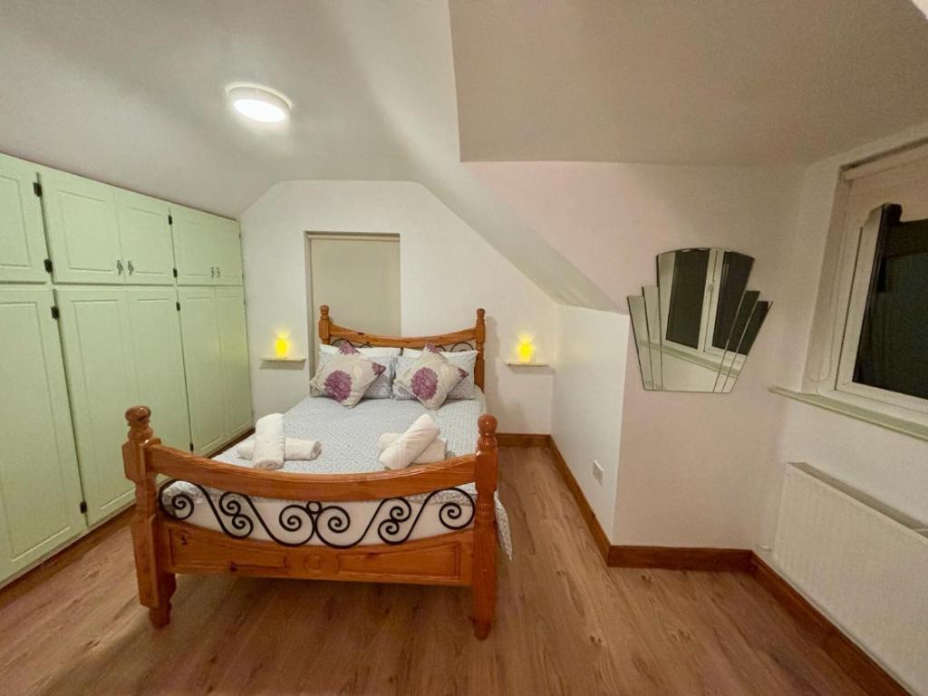a bedroom with a wooden bed in a room at Seafront House in Sligo
