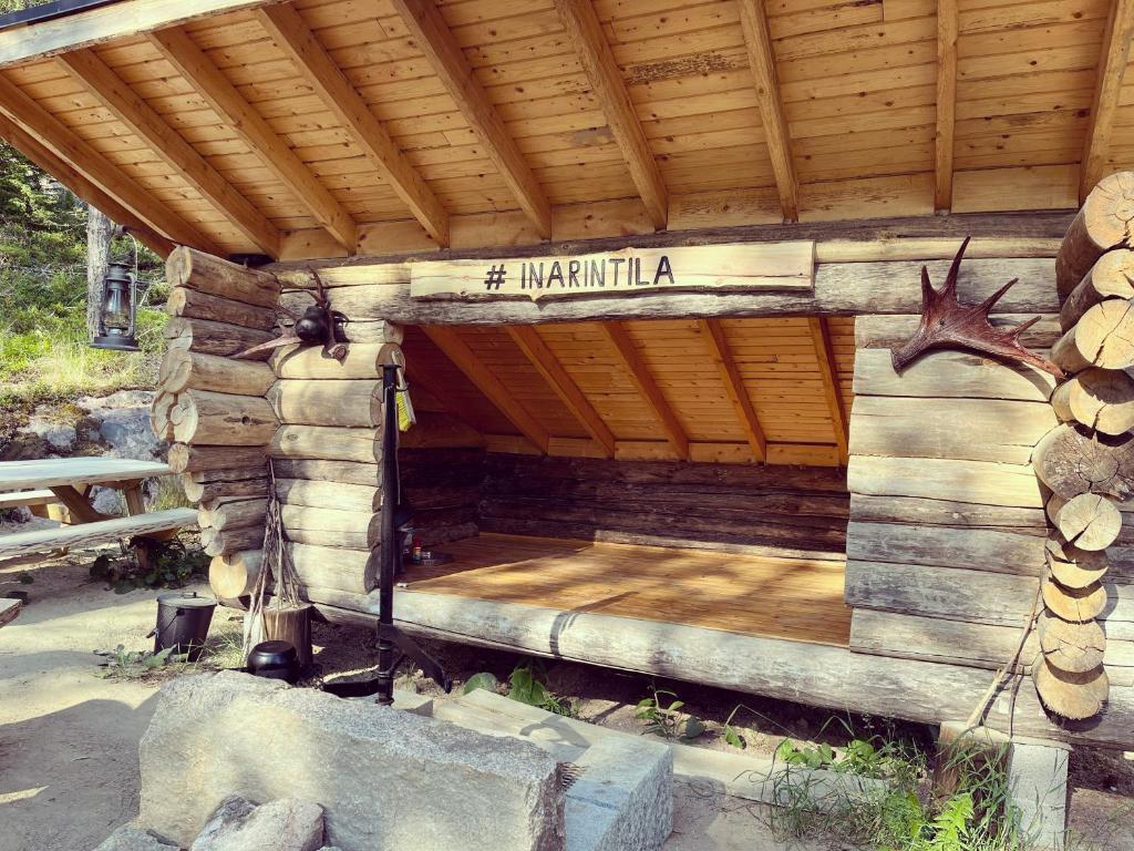 a wooden building with a sign that reads mammothilla at Lammastilan laavu - Lean to Inarin tila in Salo