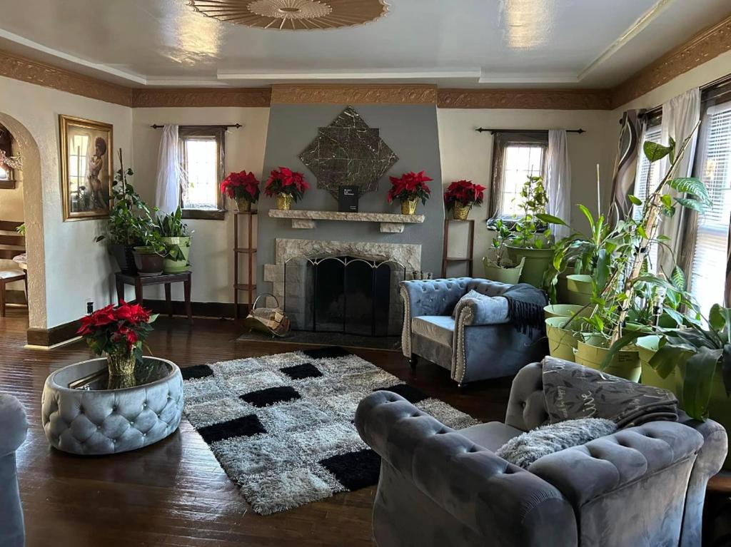 a living room with a couch and a fireplace at Marygrove Manor in Detroit