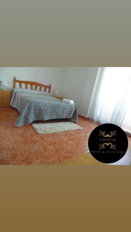 Postel nebo postele na pokoji v ubytování Hotel COSTAS