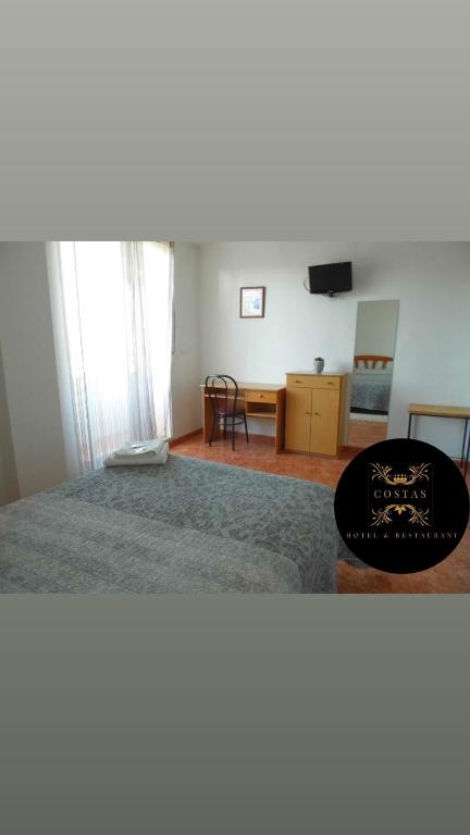 Postel nebo postele na pokoji v ubytování Hotel COSTAS