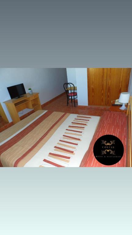 Postel nebo postele na pokoji v ubytování Hotel COSTAS