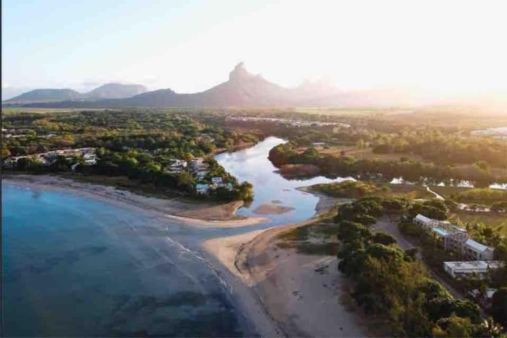 an aerial view of a beach and the ocean at Sanjana & Julien's in Tamarin