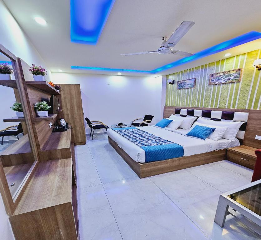 a bedroom with a large bed in a room at Hotel MANUAL GRAND Near International Airport BY-Gross Group in New Delhi