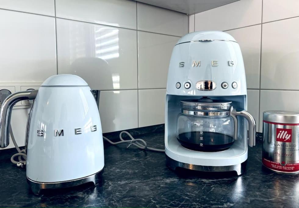 two blenders sitting on a counter in a kitchen at Lakefront View Entire Apartment with 2 bedrooms, 2 full bathrooms & Balcony Waterview in Reichenau