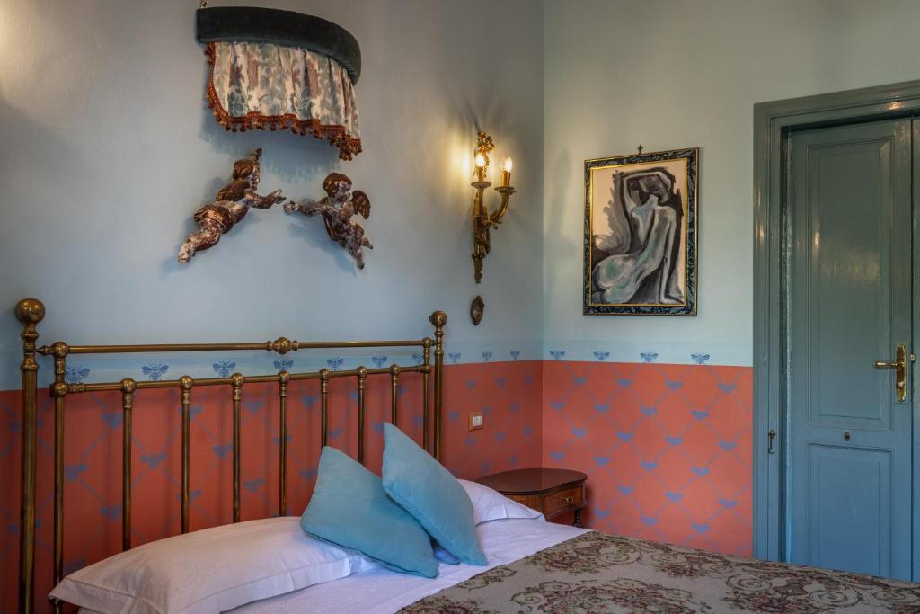 Postel nebo postele na pokoji v ubytování Villa Nicolaci - Liberty Suites