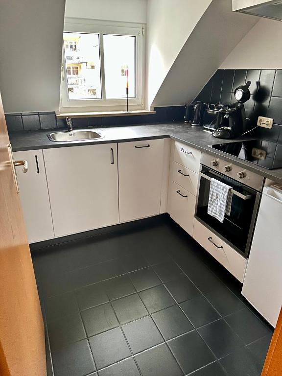 Kuchyň nebo kuchyňský kout v ubytování Sonnen Apartment