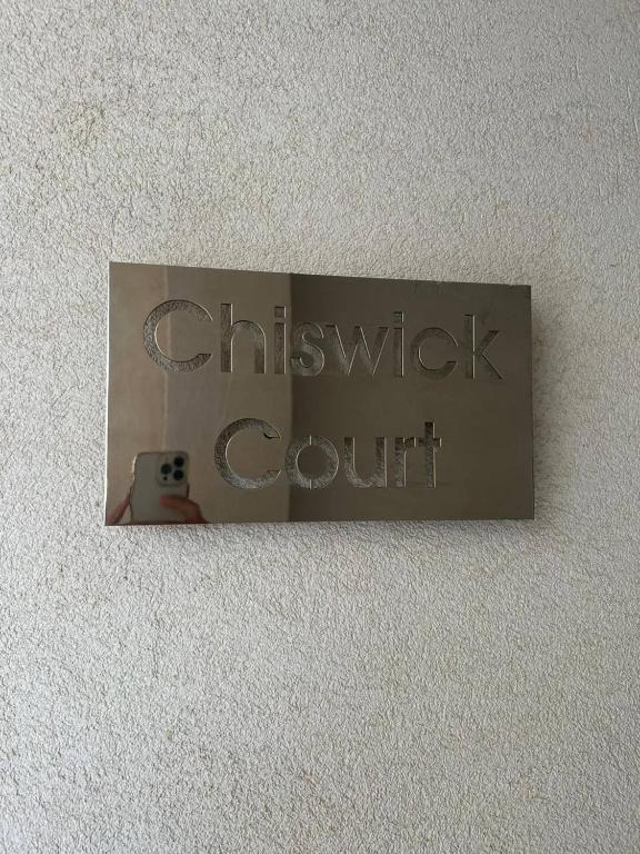 a sign that says christchurch court on a wall at Cosy 2bed Apartment In Manikata By Homely in Mellieħa