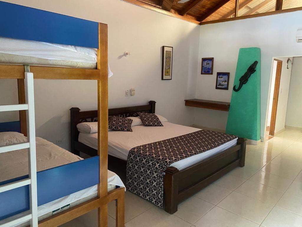a bedroom with two bunk beds in a room at hotel Vila orlanda finca hotel eventos in Montería