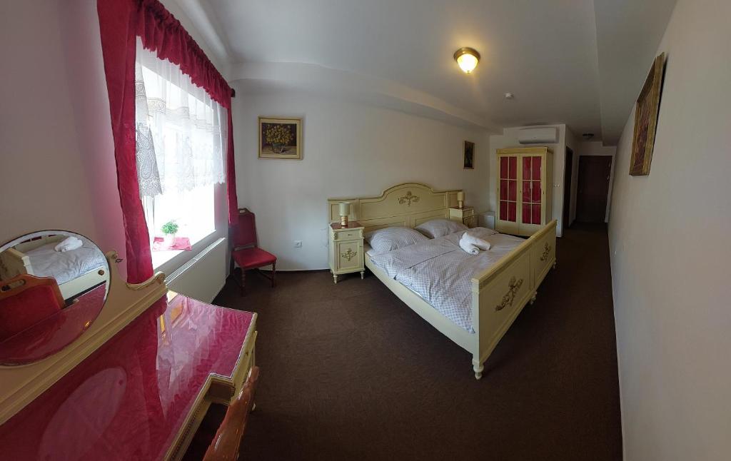 Postel nebo postele na pokoji v ubytování Hotel u Jindry