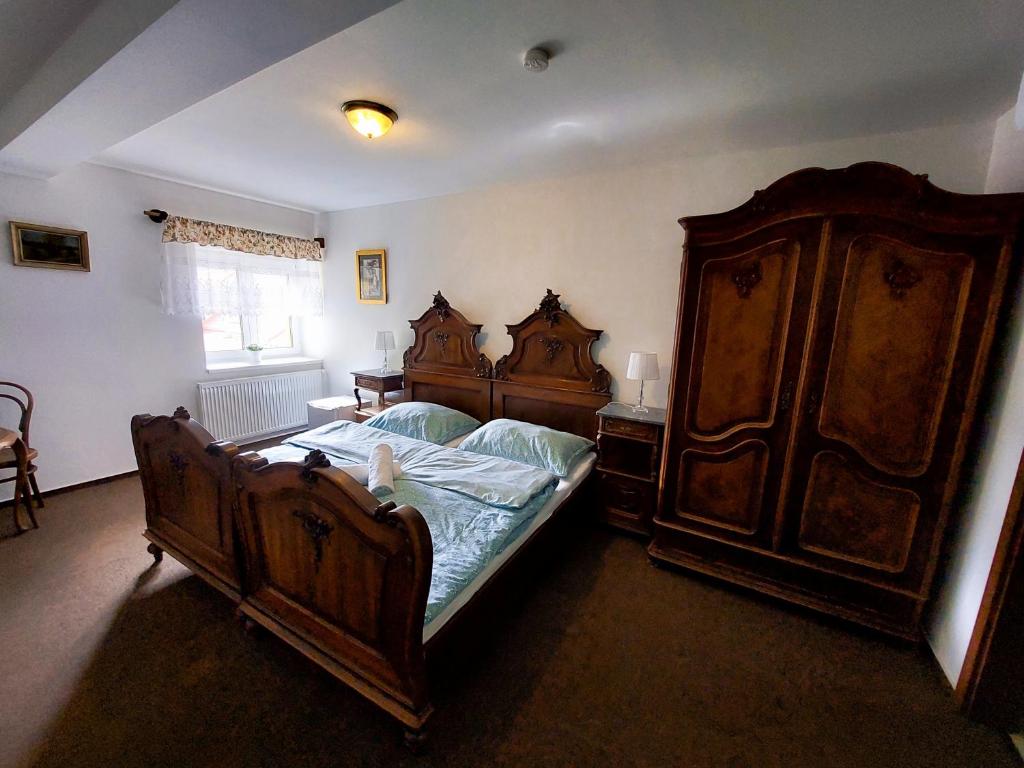 Postel nebo postele na pokoji v ubytování Hotel u Jindry