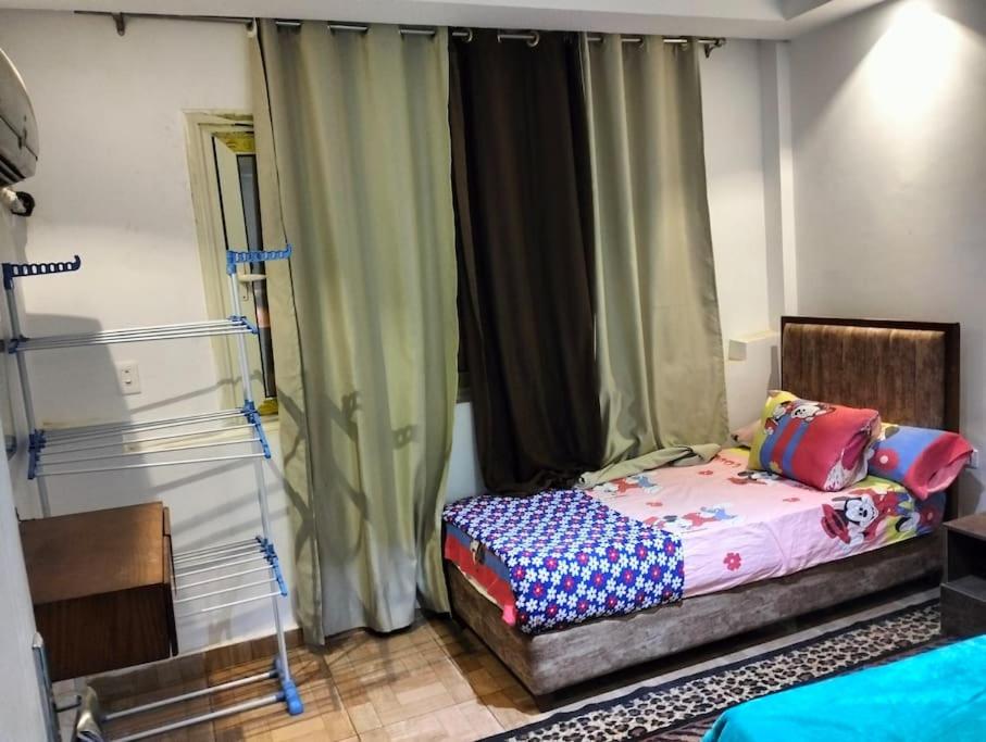 Postel nebo postele na pokoji v ubytování استديو مميز عالبسين والاكوا بارك للعائلات فقط اسره