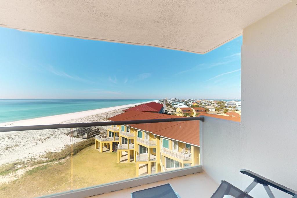a view of the beach from the balcony of a house at Regency Towers W 707 in Pensacola Beach