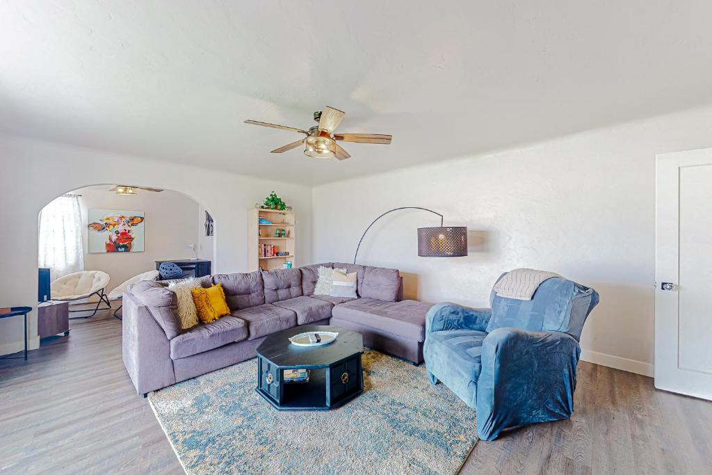 a living room with a couch and two chairs at Make Mine Mesa - Unit A in Mesa