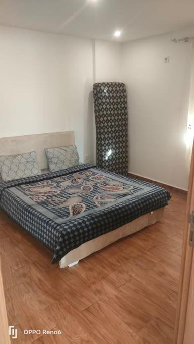Ein Bett oder Betten in einem Zimmer der Unterkunft appartement Oran F2 promotionnel