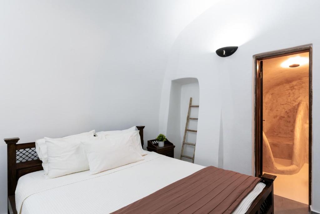 Postel nebo postele na pokoji v ubytování Enalion Suites