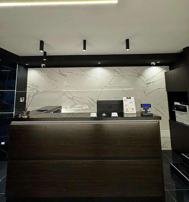 a counter in a store with a cash register at Best Western Hotel dei Mille in Naples