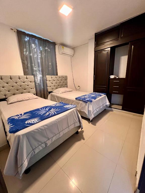 Postel nebo postele na pokoji v ubytování Apartamento confort Edificio Monteverde en el corazón de valledupar