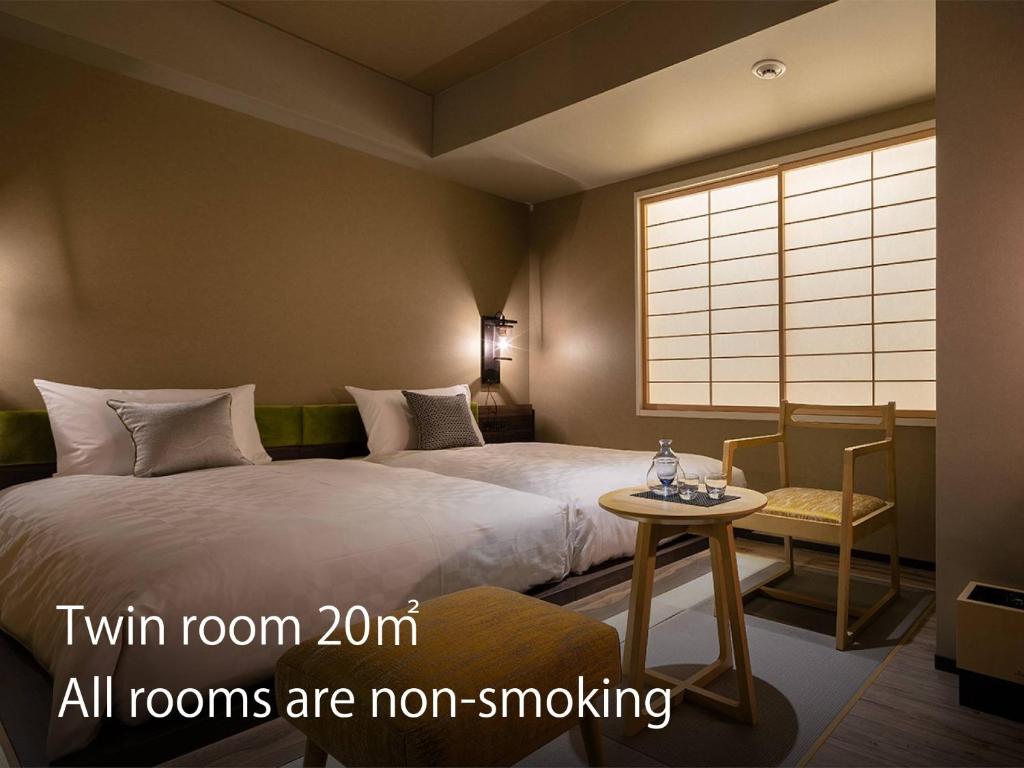 Postel nebo postele na pokoji v ubytování Hotel Resol Kyoto Kawaramachi Sanjo