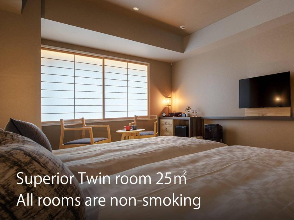 Postel nebo postele na pokoji v ubytování Hotel Resol Kyoto Kawaramachi Sanjo