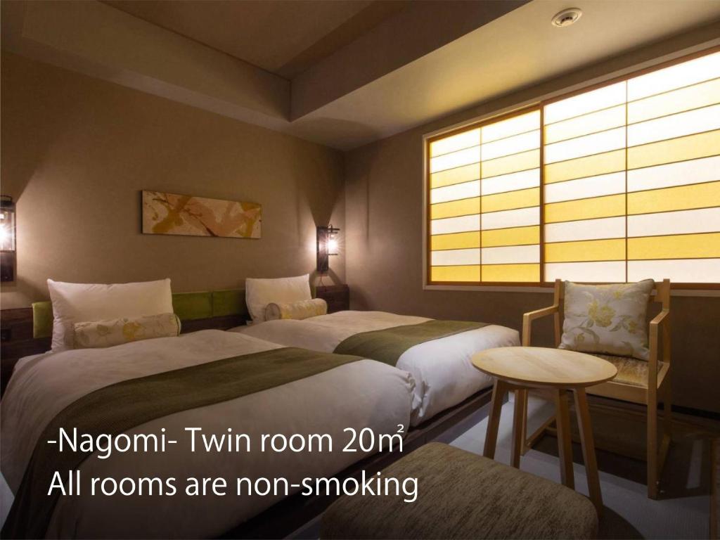 Postel nebo postele na pokoji v ubytování Hotel Resol Kyoto Kawaramachi Sanjo