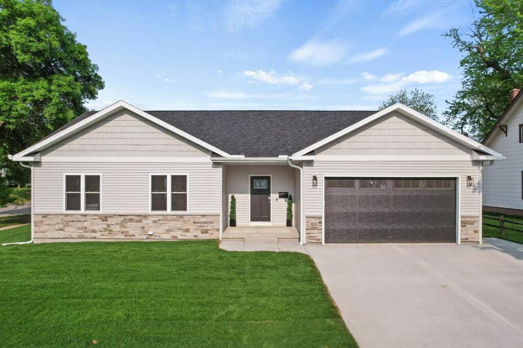 a white house with a garage at Dells Domain in Wisconsin Dells