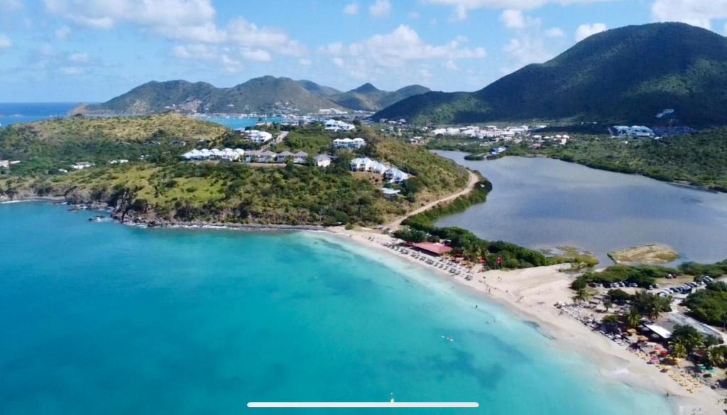 an aerial view of a beach with a resort at Appartement Saint Martin Friars Bay Sunset Paradise in Friar's Bay