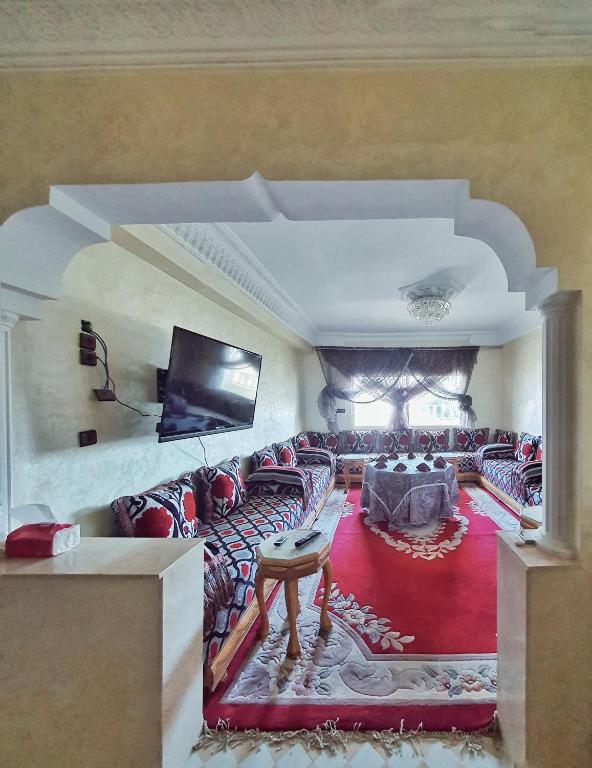 TV a/nebo společenská místnost v ubytování logement exceptionnel réservé aux familles