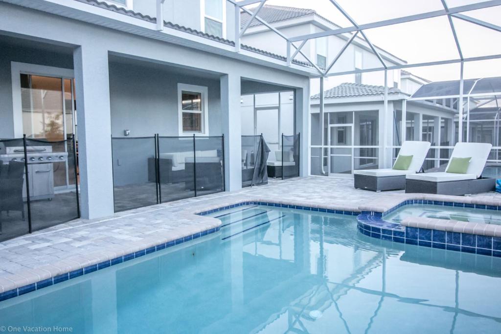 a swimming pool in a house with a house at 1581 PD - Exquisite 6BR Haven: Private Pool in Davenport
