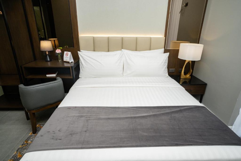 Postel nebo postele na pokoji v ubytování Amber Hotel - Cebu
