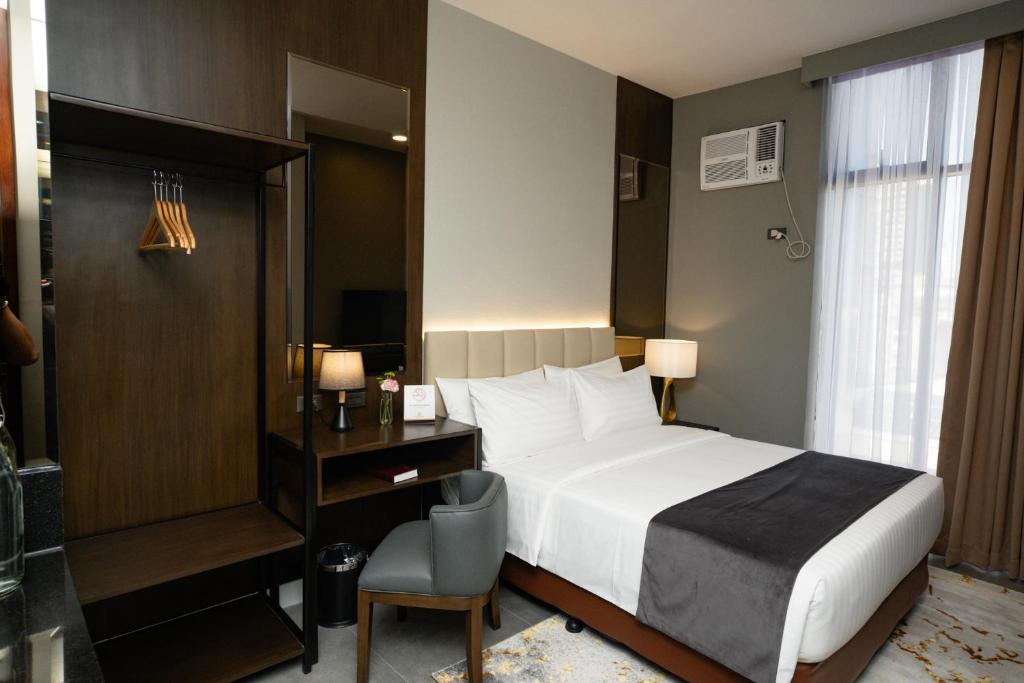 Postel nebo postele na pokoji v ubytování Amber Hotel - Cebu