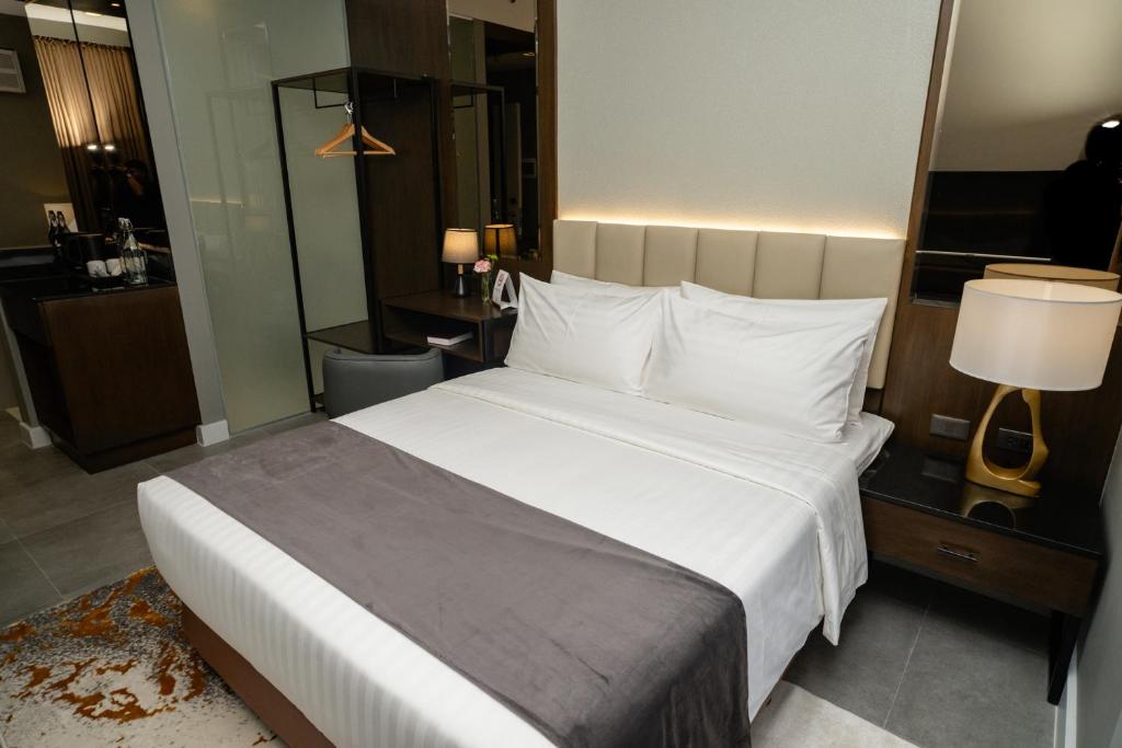 Postel nebo postele na pokoji v ubytování Amber Hotel - Cebu