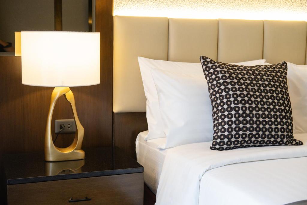 Postel nebo postele na pokoji v ubytování Amber Hotel - Cebu