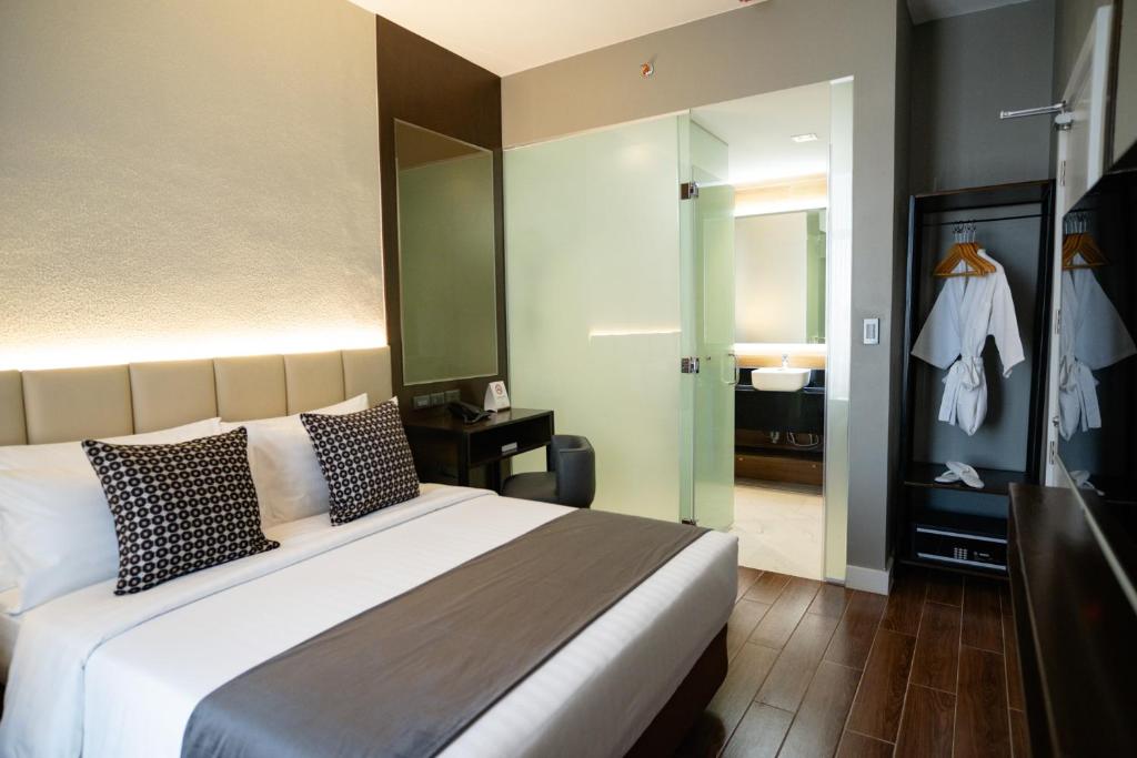 Postel nebo postele na pokoji v ubytování Amber Hotel - Cebu