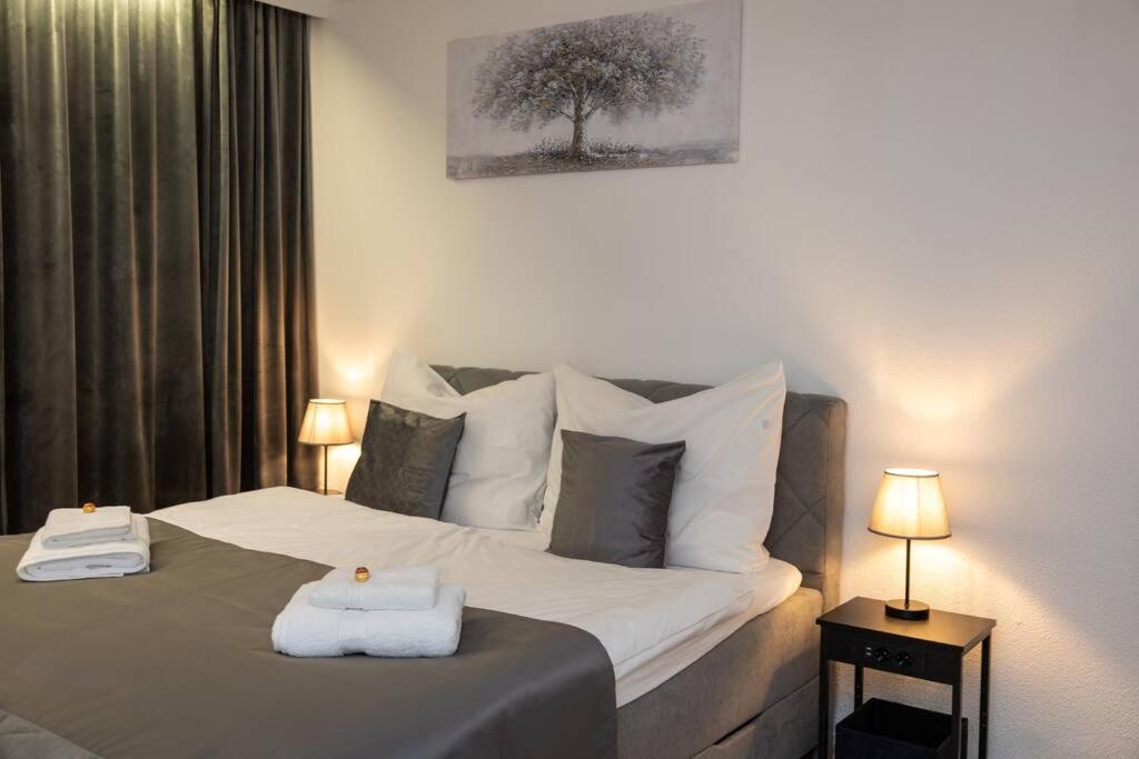 Postel nebo postele na pokoji v ubytování Apartment am Ossiachersee mit eigenem Seezugang