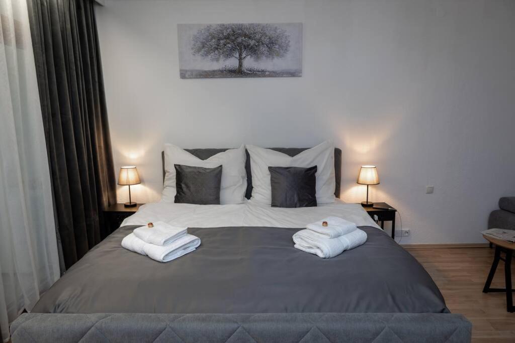 Postel nebo postele na pokoji v ubytování Apartment am Ossiachersee mit eigenem Seezugang