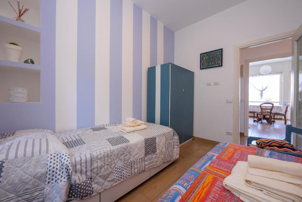 Łóżko lub łóżka w pokoju w obiekcie Residenza La terrazza di Dante - Happy Rentals